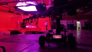 Jib on red lit stage